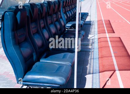 vip empty blue seats on outdoor sport stadium arena for football fans, luxury. Stock Photo