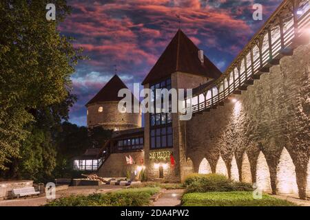 Night garden of the Danish king. Medieval watchtowers in the courtyard of the old city. Dramatic sunset sky Stock Photo