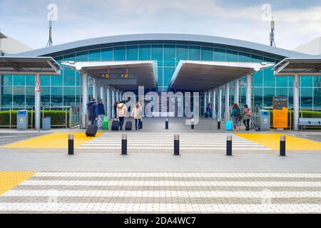 LARNACA, CYPRUS - FEB 21, 2019: People at the entrance of Larnaca International Airport – Glafcos Clerides Stock Photo