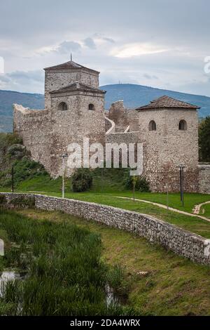 Beautiful, ancient fortress Momcilov grad in Pirot, city park and small river covered by green reed Stock Photo