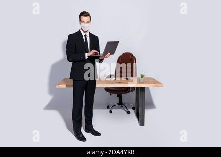 Full body photo of handsome business guy hold notebook hands wear white face mask isolated grey background Stock Photo