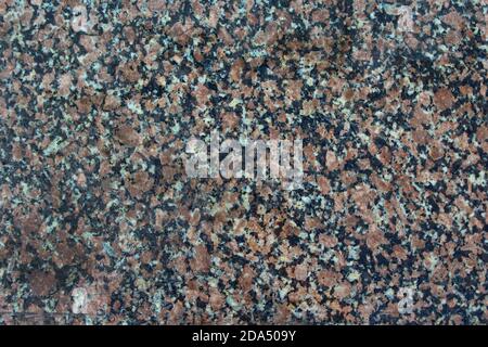 Red gray polished granite close-up texture as nature background Stock Photo