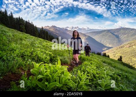 Adventurous people Hiking in the Canadian Mountains Stock Photo