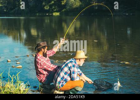 Fly Fishing for Trout. Fishing in River. Catches a Fish. Catching a Big  Fish with a Fishing Pole Stock Photo - Image of catch, male: 152875132