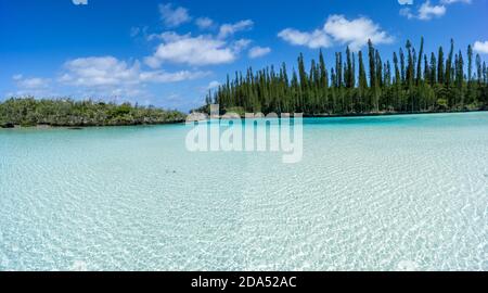 beautiful seascape of natural swimming pool of Oro Bay, Isle of Pines, New Caledonia. aquamarine translucent water. Stock Photo