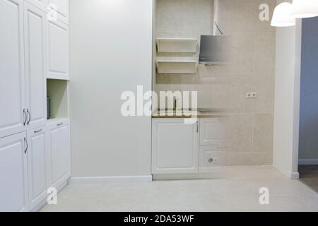 Comparison of a small kitchen room in an apartment before and after renovation new house, close up. Beautiful custom kitchen design and photo combinat Stock Photo