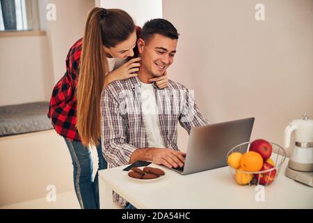 Young couple looking at the laptop screen Stock Photo