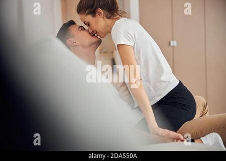 Two loving spouses enjoying their tender kiss Stock Photo