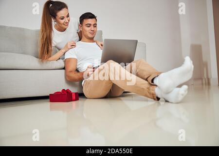 Focused married couple surfing the net together Stock Photo