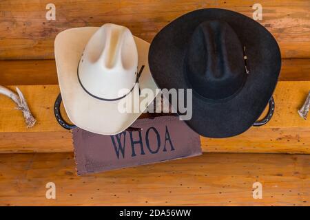 Close up of cowboy hats hanging up on a ranch, British Colombia, Canada. Stock Photo