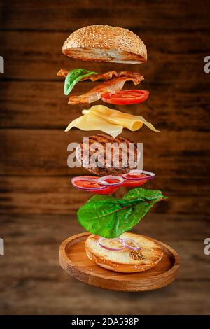 Delicious Hamburger With Flying Ingredients Stock Photo Alamy