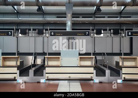 Check-in counters and baggage conveyors at an airport Stock Photo - Alamy
