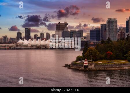 Brockton Point Lighthouse in Stanley Park with Downtown Vancouver Stock Photo