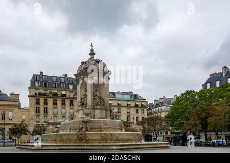 Paris, France - August 29, 2019 : The fountain of the Saint-Sulpice square. Saint-Sulpice is a Roman Catholic church in Paris. It is the second larges Stock Photo