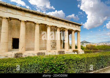 The Temple of Hephaestus or Hephaisteion or earlier as the Theseion, is a well-preserved Greek temple in Athens Greece, with Mount Lycabettus behind. Stock Photo