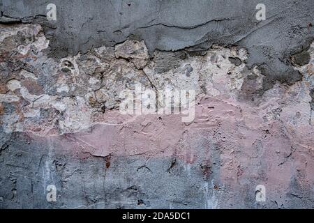 pink grunge wall with cracked paint and cracks  Stock Photo