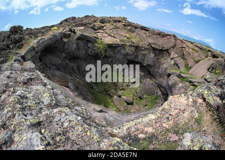 deep abyss in 1832 ancient lava cooled around Egitto Mount in Etna Park, Sicily Stock Photo