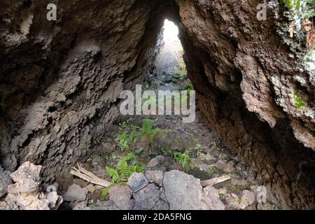 lava tube is natural conduit formed by flowing lava in Etna Park, Sicily Stock Photo