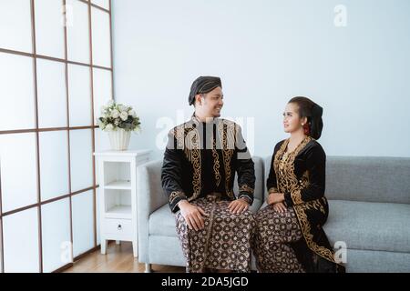 Portrait of a happy family wearing traditional Javanese clothes. concept of  family photo Javanese traditional clothes in the living room Stock Photo -  Alamy