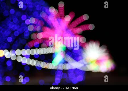 The bokeh light obtained by focusing the lens until blurred to create a fireworks-like background. Stock Photo