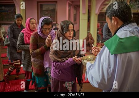 Kathmandu, Nepal, January 2016. Interior of a Catholic church at the time of communion. Stock Photo