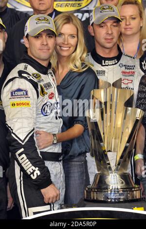 Homestead, United States Of America. 16th Nov, 2008. HOMESTEAD, FL - NOVEMBER 16: (L-R) Jimmie Johnson, driver of the #48 Lowe's/Kobalt Tools Chevrolet, and his wife Chandra pose on stage after winning the 2008 NASCAR Sprint Cup Series Championship after the Ford 400 at Homestead-Miami Speedway on November 16, 2008 in Homestead, Florida People: Jimmie Johnson, Chandra Johnson Credit: Storms Media Group/Alamy Live News Stock Photo