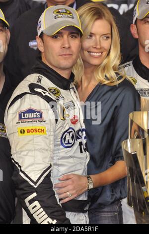 Homestead, United States Of America. 16th Nov, 2008. HOMESTEAD, FL - NOVEMBER 16: (L-R) Jimmie Johnson, driver of the #48 Lowe's/Kobalt Tools Chevrolet, and his wife Chandra pose on stage after winning the 2008 NASCAR Sprint Cup Series Championship after the Ford 400 at Homestead-Miami Speedway on November 16, 2008 in Homestead, Florida People: Jimmie Johnson, Chandra Johnson Credit: Storms Media Group/Alamy Live News Stock Photo