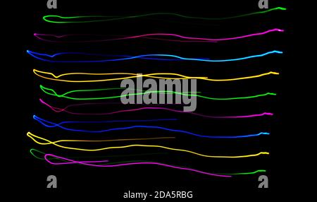 Multi color light painting photography, swirl and curve of blue, green and red light against a black background Stock Photo