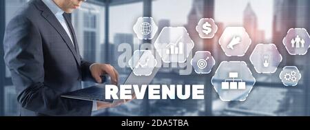 Increase revenue concept. Businessman pressing inscription revenue. Stock Photo