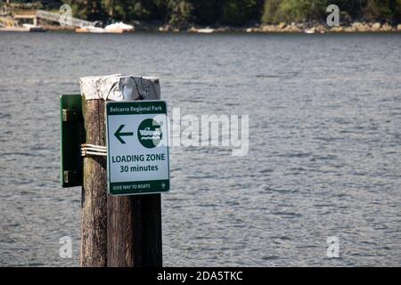 Vancouver, Canada - July 13, 2020: View of sign 'Loading zone 30 minutes' on a pier in Belcarra Regional Park Stock Photo