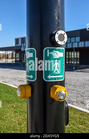 Yellow button and green road signs pedestrian crossing Stock Photo