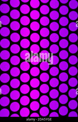 Vertical image of geometric pattern of the elevator ceiling in purple pink and black color Stock Photo