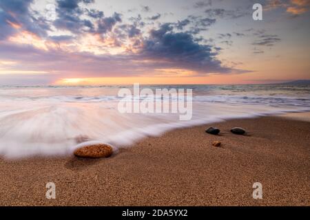 Sand beach of a seashore with a wave Stock Photo - Alamy