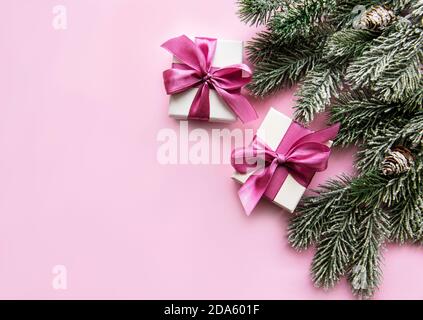 Christmas composition. Christmas gifts, pink decorations on pastel pink background. Flat lay, top view, copy space Stock Photo