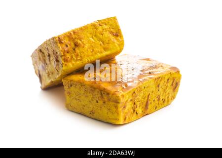 Dices of marinated tofu isolated on white background. Stock Photo