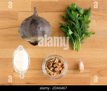 Ingredients for making beetroot and nut salad. View from above. Stock Photo
