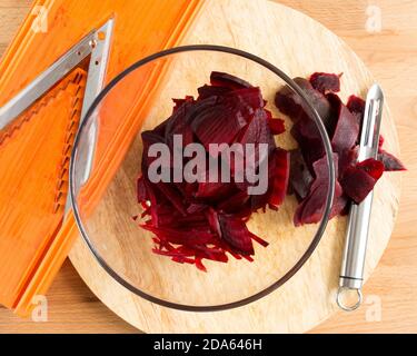 Boiled beets grated in strips in a bowl. Stock Photo