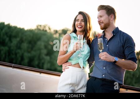 Romantic happy couples dancing and drinking at party Stock Photo