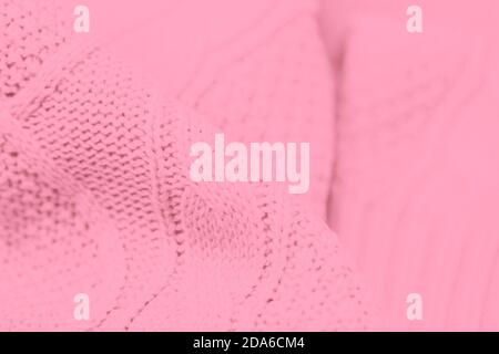 Light pink fabric background. Full frame shot of knitted fabric Stock Photo