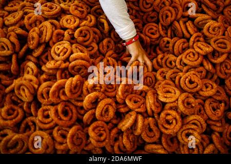Kathmandu, Nepal. 10th Nov, 2020. A confectioner cooks traditional ...