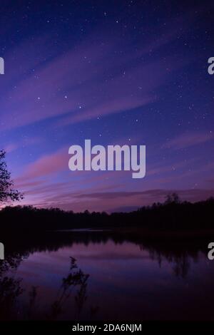 Bog lake in germany at breaking night with great bear above Stock Photo