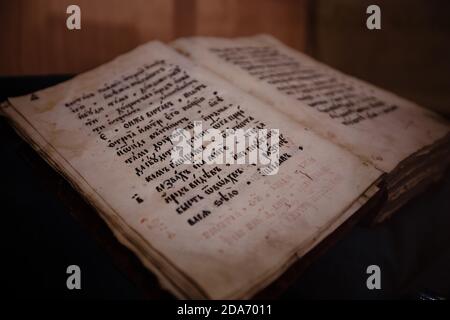 Old christian book Gospel written on Old Slavjanic Russian Cyrillic Yelets, Russia, October 24, 2020 Stock Photo