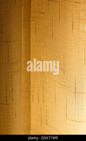 Light coming through a sheer cotton lace curtain. Abstract full frame background. Stock Photo