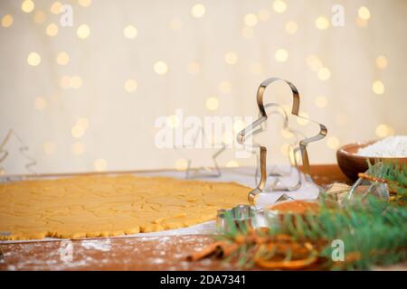 forms for gingerbread Christmas men and stars, close-up, top view, raw dough with cinnamon prepared for baking Stock Photo