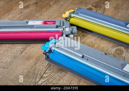 Toner cartridges for color laser printers in yellow, cyan and magenta. Used rollers Stock Photo