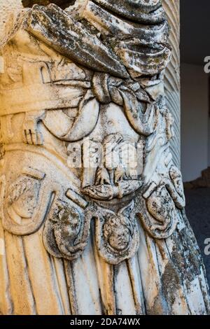 Vertical shot of a headless statue in the famous Roman ruins in Timgad, Algeria Stock Photo