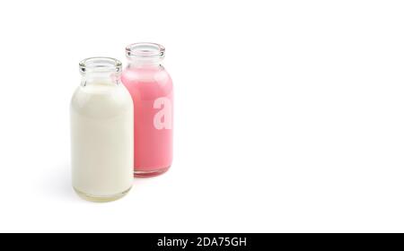 Two cocktail bottles of different colors isolated on a white background. Stock Photo