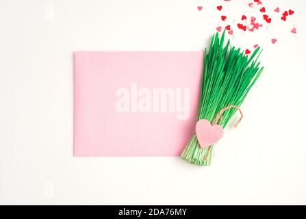 Holiday background with pink envelope and green envelope. Stock Photo