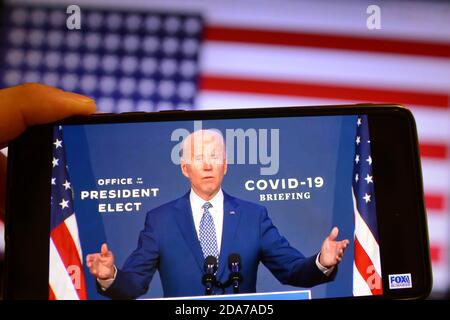 In this photo illustration the U.S. President-elect Joe Biden speaks during a media briefing in Wilmington on a YouTube video displayed on a screen of a smartphone. (Photo by Aleksandr Gusev / Pacific Press) Stock Photo