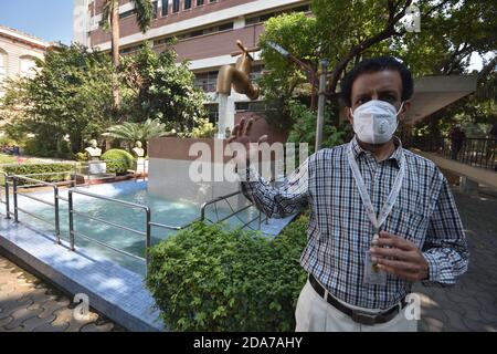 Venkatraman Subramanian Ramachandran, Director, Birla Industrial & Technological Museum (BITM) explains the 'Giant Magic Tap', an outdoor exhibit of floating tap fountain hovering above a pool, with endless supply of water gushing out of it, seemingly from nowhere, it was thrown open for public as the BITM managed by National Council of Science Museums (NCSM) under Ministry of Culture, Govt. of India, reopen after 240 days on the 'World Science Day for Peace and Development' for general visitors amid Covid with some restrictions as a measure to prevent spreading the virus. (Photo by Biswarup G Stock Photo